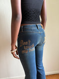 Load image into Gallery viewer, 00's Dolce & Gabbana "Don't Touch" low-rise flared jeans• Size 8
